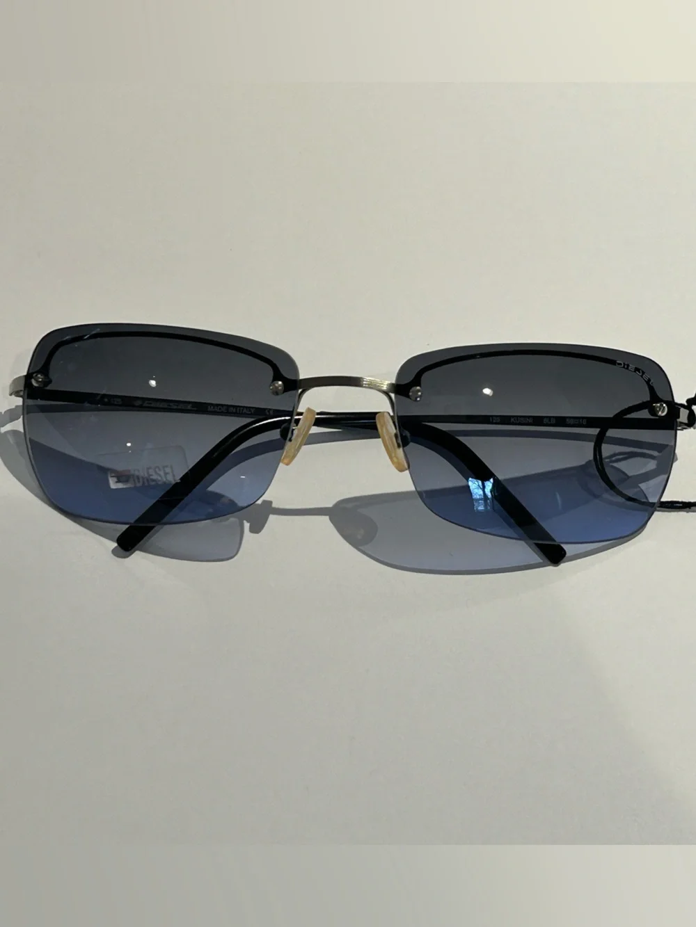 Diesel Gunmetal Frame Blue Gradient Lens Rimless Sunglasses -Kusini